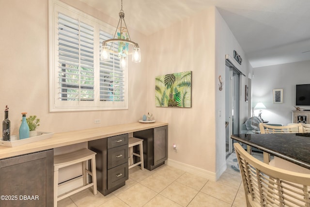 office area featuring light tile patterned flooring and a notable chandelier