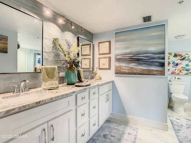 4 Oceans W Blvd Unit 307D, Daytona Beach Shores, FL 32118 - full bath with toilet, double vanity, and baseboards