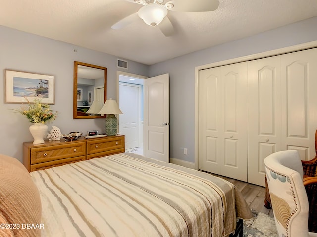 4 Oceans W Blvd Unit 307D, Daytona Beach Shores, FL 32118 - bedroom featuring wood finished floors, a closet, ceiling fan, and baseboards