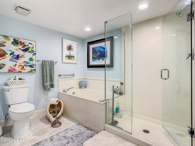 bathroom featuring shower with separate bathtub and toilet