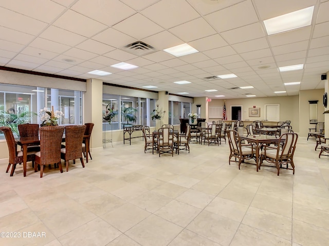 4 Oceans W Blvd Unit 307D, Daytona Beach Shores, FL 32118 - dining space featuring a paneled ceiling and light tile patterned floors