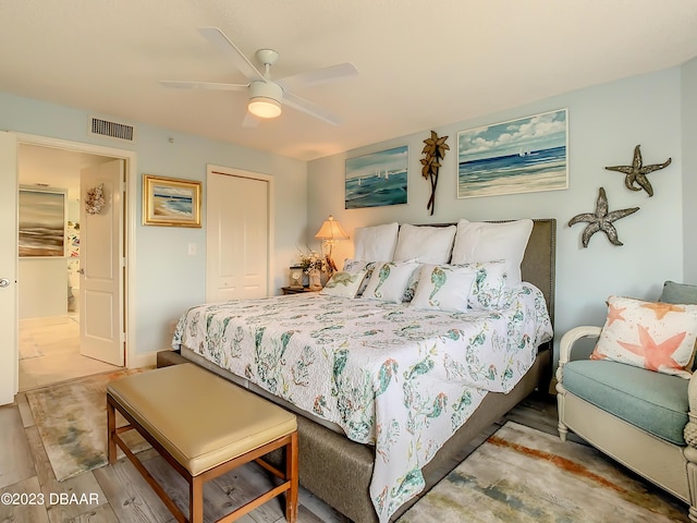 4 Oceans W Blvd Unit 307D, Daytona Beach Shores, FL 32118 - bedroom featuring a ceiling fan, a closet, and wood finished floors