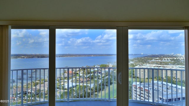 unfurnished sunroom with a water view and a healthy amount of sunlight