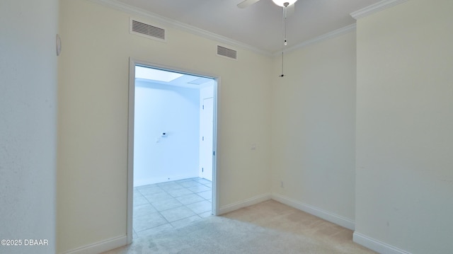 carpeted spare room with crown molding and ceiling fan