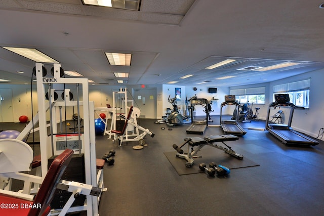 gym featuring a drop ceiling