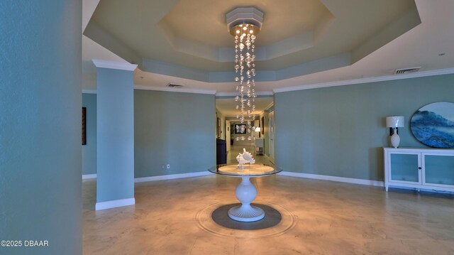 unfurnished dining area featuring a tray ceiling and ornamental molding