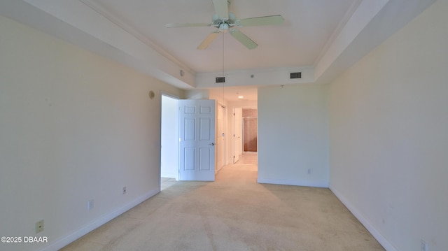 carpeted empty room featuring crown molding and ceiling fan