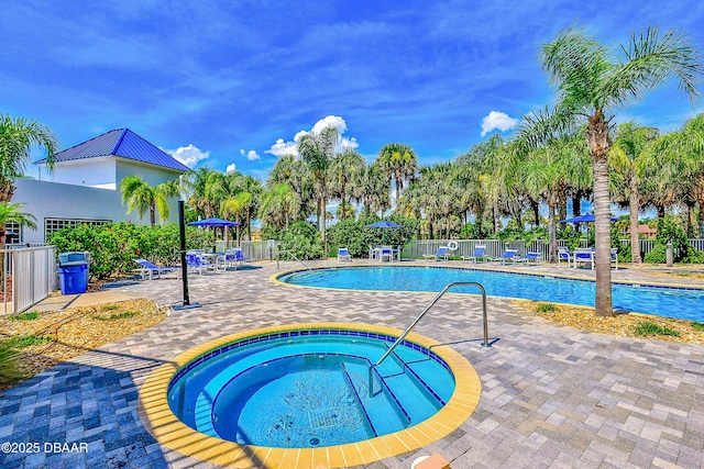 view of swimming pool with a community hot tub