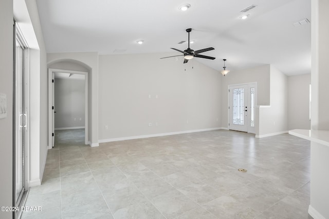 30 Peppercorn Ln, Palm Coast, FL 32164 - unfurnished living room with ceiling fan, arched walkways, lofted ceiling, light tile patterned flooring, and recessed lighting