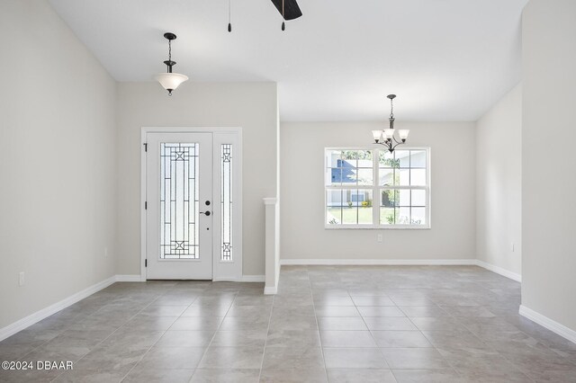 30 Peppercorn Ln, Palm Coast, FL 32164 - foyer featuring a chandelier, light tile patterned floors, ceiling fan, and baseboards
