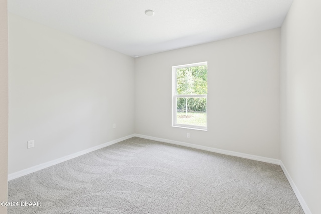 30 Peppercorn Ln, Palm Coast, FL 32164 - empty room with carpet floors and baseboards
