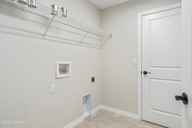 30 Peppercorn Ln, Palm Coast, FL 32164 - washroom featuring hookup for an electric dryer, washer hookup, baseboards, and light tile patterned flooring