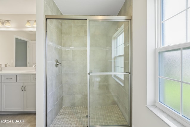 30 Peppercorn Ln, Palm Coast, FL 32164 - bathroom with a shower stall, vanity, and plenty of natural light