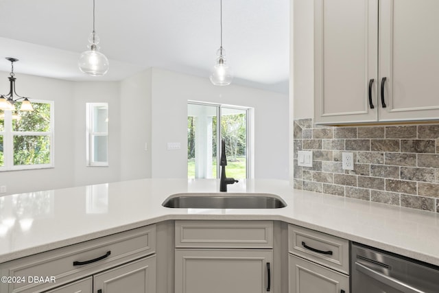 30 Peppercorn Ln, Palm Coast, FL 32164 - kitchen featuring a sink, plenty of natural light, light countertops, and stainless steel dishwasher