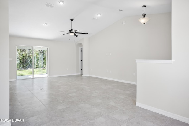 30 Peppercorn Ln, Palm Coast, FL 32164 - spare room with vaulted ceiling, a ceiling fan, arched walkways, light tile patterned floors, and baseboards