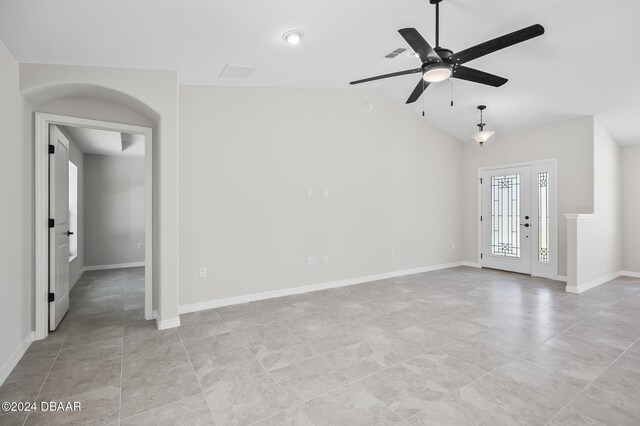 30 Peppercorn Ln, Palm Coast, FL 32164 - empty room with a ceiling fan, lofted ceiling, light tile patterned floors, and baseboards