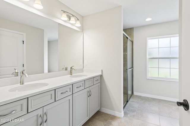 30 Peppercorn Ln, Palm Coast, FL 32164 - bathroom with a stall shower, double vanity, tile patterned flooring, and baseboards