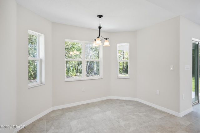 30 Peppercorn Ln, Palm Coast, FL 32164 - unfurnished room featuring plenty of natural light and baseboards