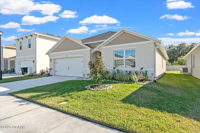 view of front of home featuring a garage and a front lawn