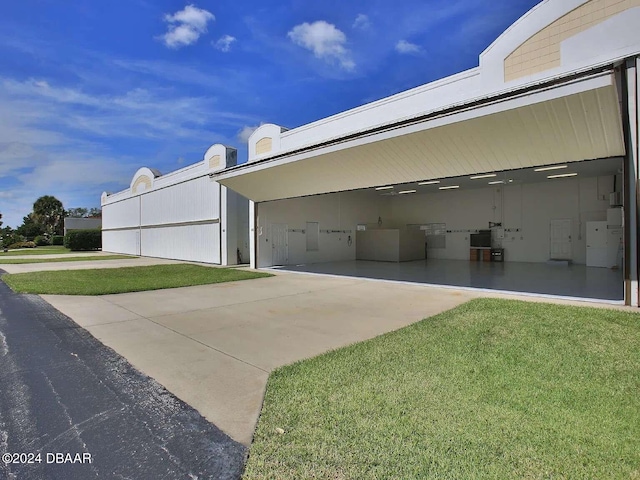 view of property exterior featuring a lawn