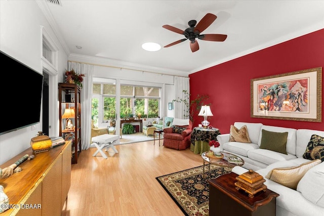 1316 Asher Ct, Ormond Beach, FL 32174 - living room with ornamental molding, a ceiling fan, and light wood-style flooring