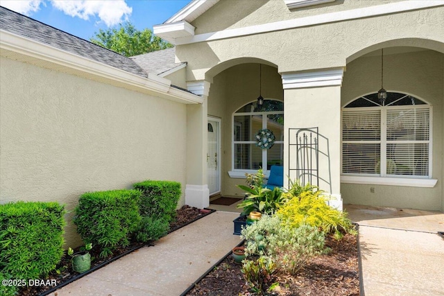 1316 Asher Ct, Ormond Beach, FL 32174 - entrance to property featuring stucco siding and a shingled roof