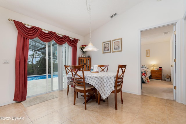 dining room with light tile patterned floors, visible vents, and baseboards