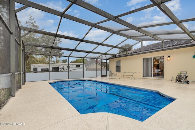 pool featuring a lanai and a patio