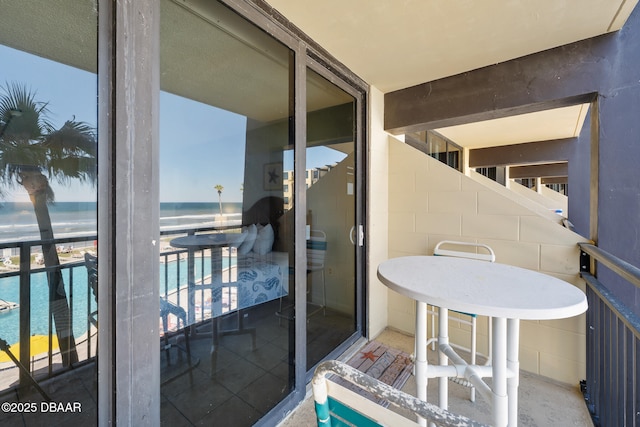 balcony featuring a water view