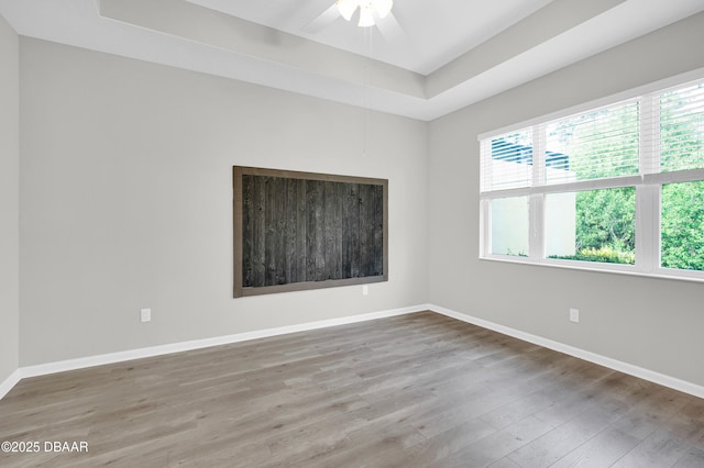 304 Coral Reef Way, Daytona Beach, FL 32124 - empty room featuring baseboards, ceiling fan, wood finished floors, and a raised ceiling