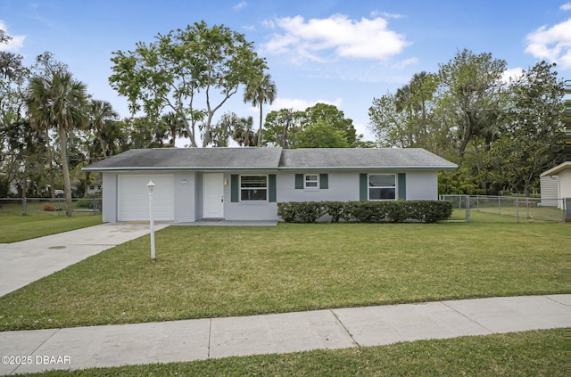 ranch-style home with a front yard, fence, concrete driveway, a garage, and brick siding