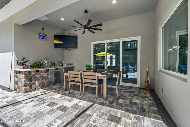 view of patio featuring ceiling fan