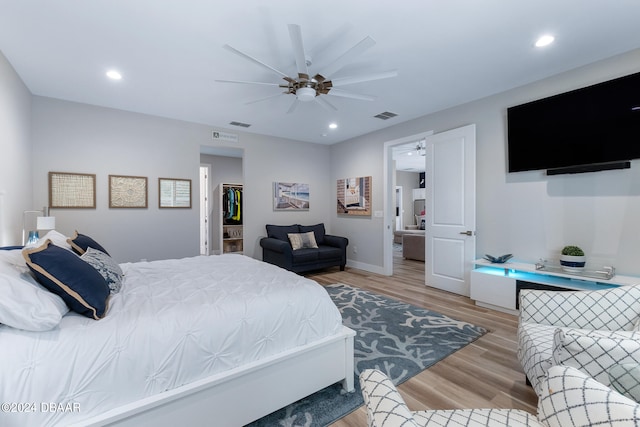 bedroom featuring ceiling fan and light wood-type flooring