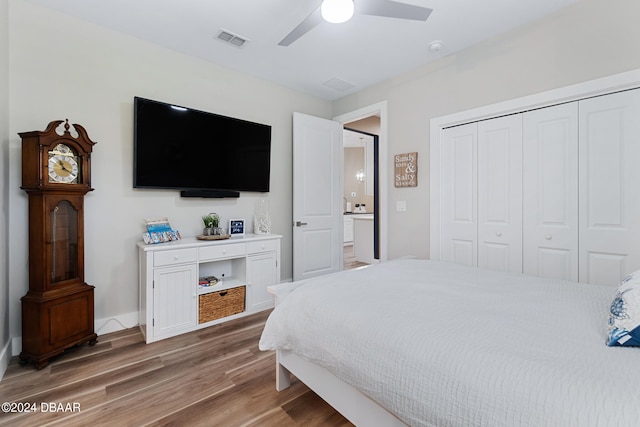 bedroom with a closet, ceiling fan, and hardwood / wood-style flooring