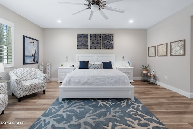 bedroom featuring light hardwood / wood-style flooring and ceiling fan