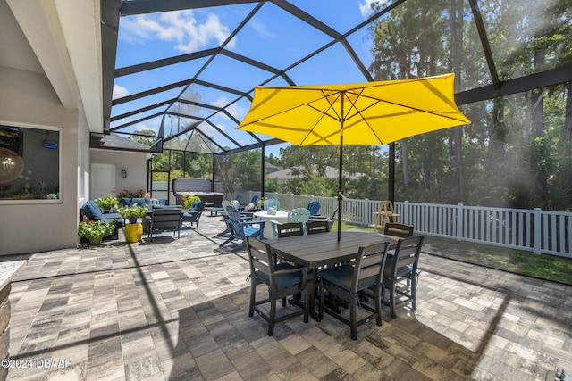 view of patio with glass enclosure