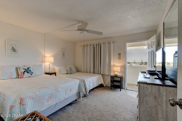 carpeted bedroom with a textured ceiling and ceiling fan