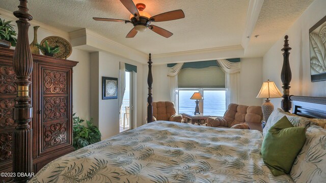 bedroom with ceiling fan, crown molding, and a textured ceiling