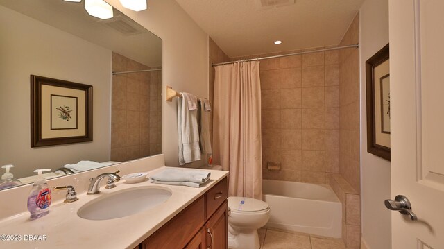 full bathroom with tile patterned floors, vanity, shower / bathtub combination with curtain, and toilet