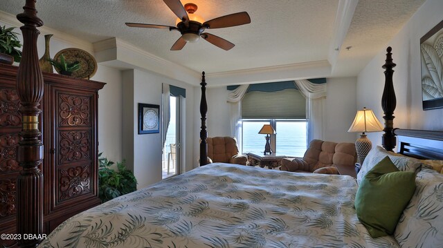 bedroom with ceiling fan, a textured ceiling, and ornamental molding