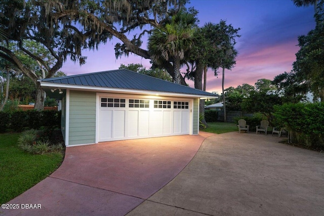 101 Azalea Cir, New Smyrna Beach, FL 32168 - garage at dusk with a detached garage