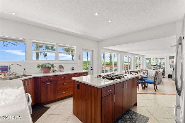 101 Azalea Cir, New Smyrna Beach, FL 32168 - kitchen with appliances with stainless steel finishes, light tile patterned floors, plenty of natural light, and recessed lighting