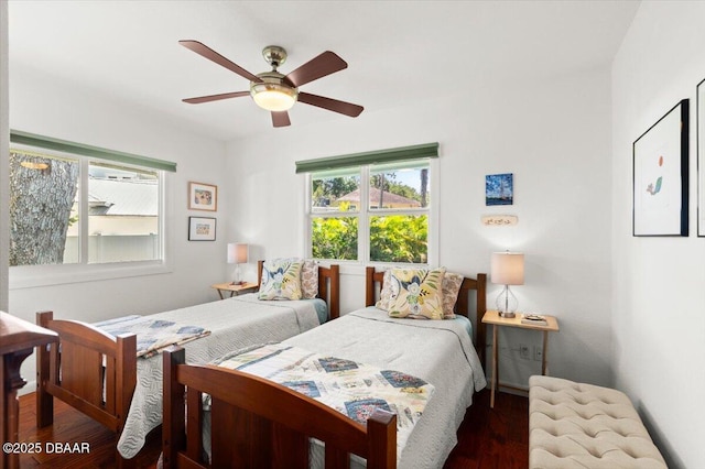101 Azalea Cir, New Smyrna Beach, FL 32168 - bedroom with multiple windows, wood finished floors, and ceiling fan