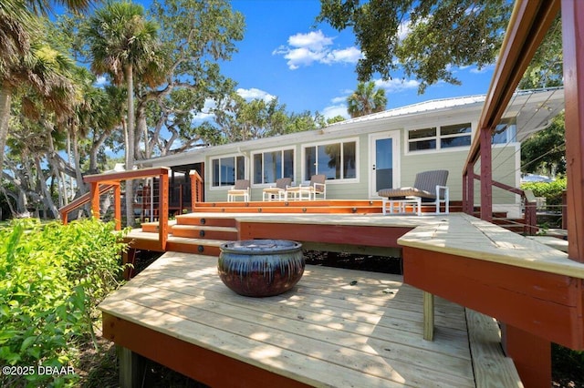 101 Azalea Cir, New Smyrna Beach, FL 32168 - back of house with a deck