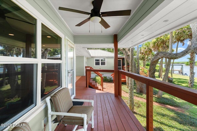 101 Azalea Cir, New Smyrna Beach, FL 32168 - wooden deck featuring a ceiling fan and a water view