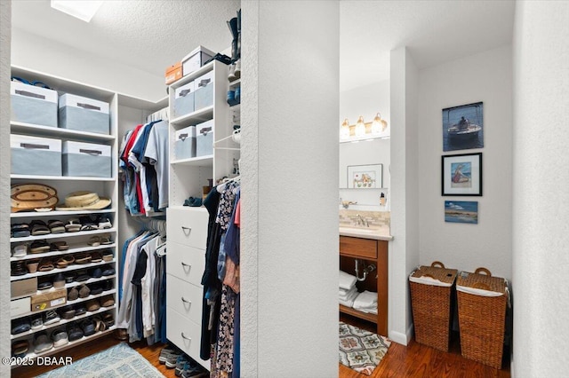 101 Azalea Cir, New Smyrna Beach, FL 32168 - walk in closet featuring wood finished floors