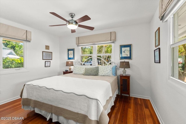 101 Azalea Cir, New Smyrna Beach, FL 32168 - bedroom with multiple windows, wood finished floors, and a ceiling fan