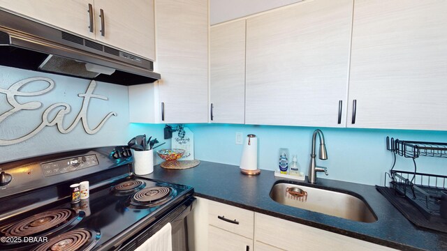 kitchen featuring electric stove, dark countertops, white cabinetry, a sink, and under cabinet range hood