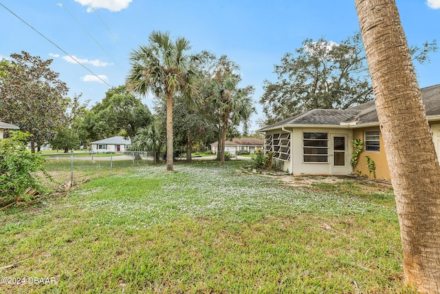 view of yard featuring a sunroom