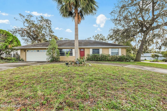 ranch-style house featuring a front yard and a garage